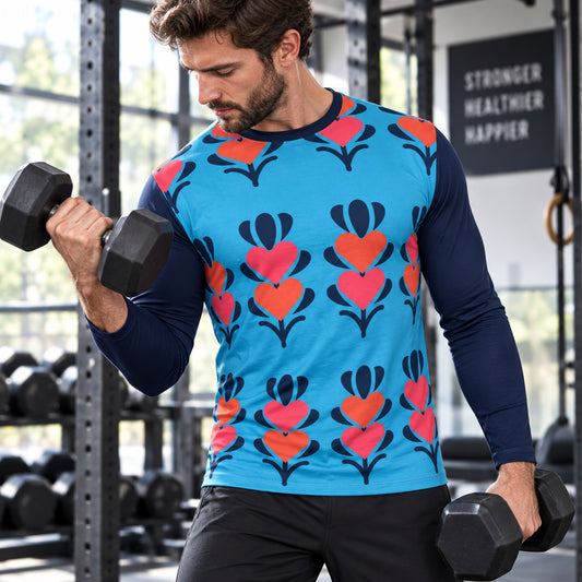 A long-sleeve crewneck shirt with a bright blue body featuring a repeating retro floral pattern in coral pink, red, and dark navy, paired with solid dark navy sleeves.